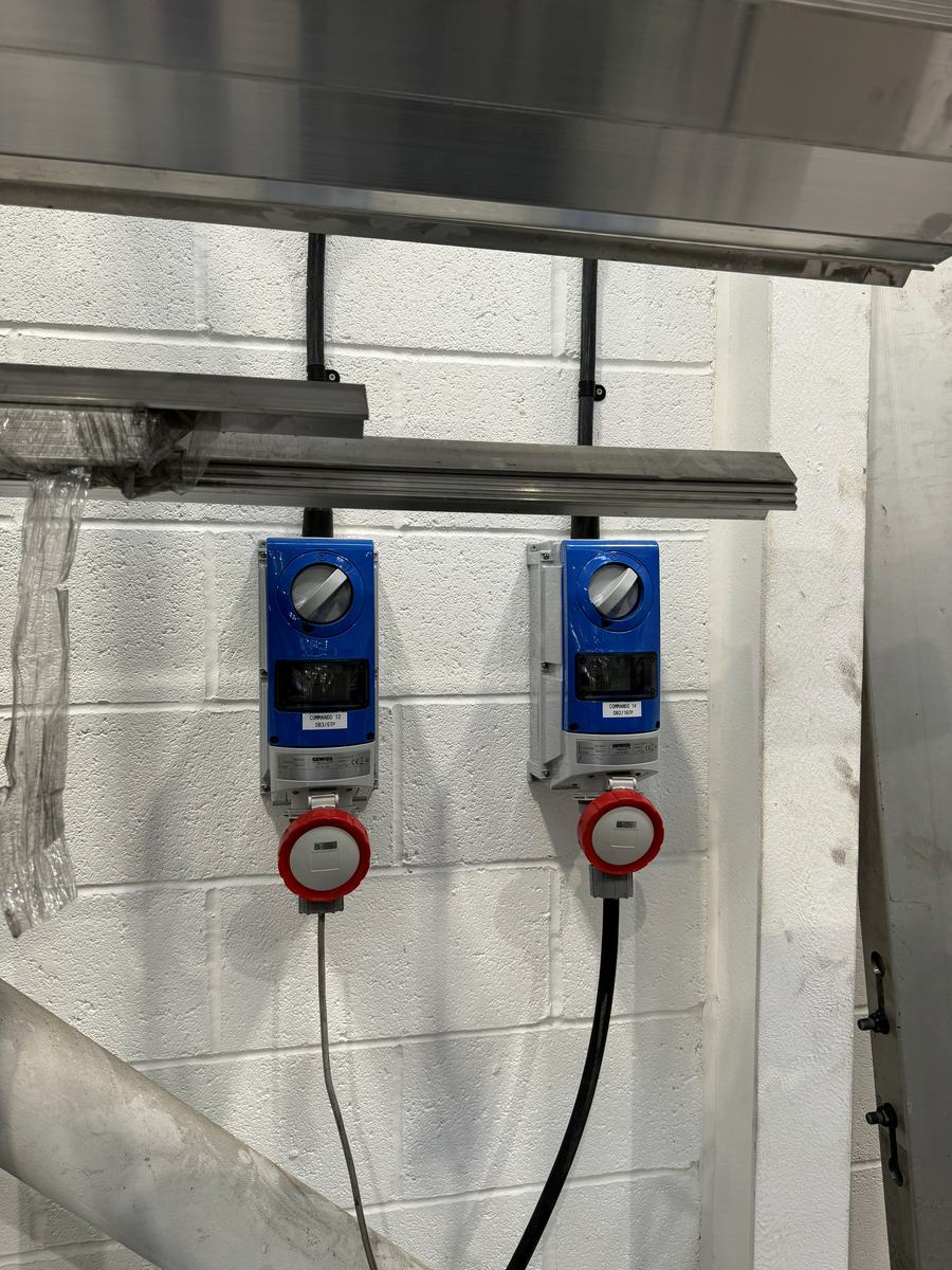 Three-phase and single-phase commando sockets installed on a workshop wall by Coutts Electrical Contractors — photograph 16 of 25