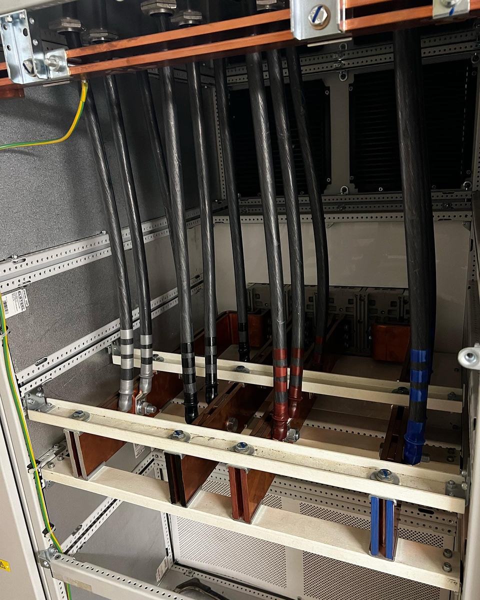 Copper busbars and armoured tails terminated inside a commercial distribution panel by Coutts Electrical Contractors — photograph 17 of 25