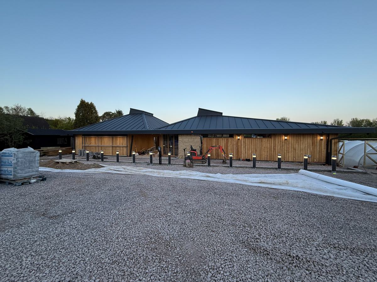The completed exterior of a timber-clad farm shop and café wired throughout by Coutts Electrical Contractors — photograph 23 of 25